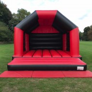 Red-and-Black-adult-bouncy-castle-main-bouncekrazee